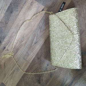 New with tags. RSVP gold glitter clutch